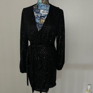 Perfect wedding guest or NYE dress! Black sparkle wrap dress!